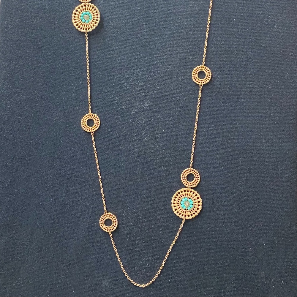 Long gold and turquoise colored necklace